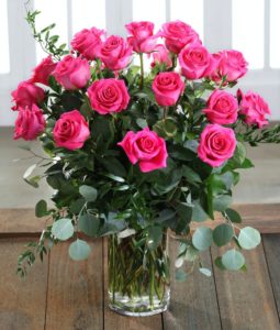 Luxurious Hot Pink Candy Roses from our Ecuadorian Mountain Farms, featuring larger blooms and vase life, this "Best in Show" variety winner was featured in 'Floral Trends' National Magazine and a Carithers exclusive!  