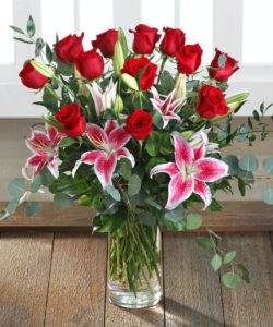 All her favorites! Long-stem red Ecuadorian Mountain roses and fragrant pink stargazer lilies. 