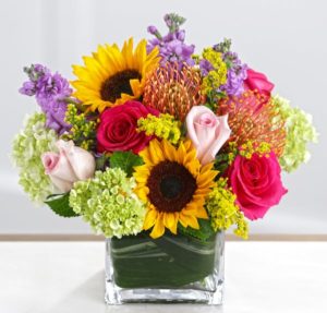 sunflower pink roses and hydrangea in a vase