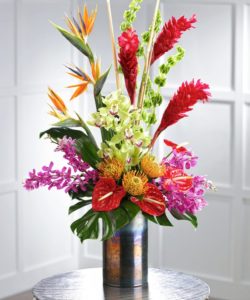 This stunning bouquet is budding with exotic birds of paradise, lush torch ginger, protea, and sprays of cymbidium orchids and lush tropical foliage guaranteed to make anyone's day special!