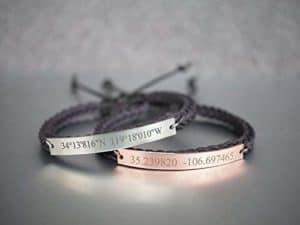 Bronze and silver bracelets with engraved coordinates