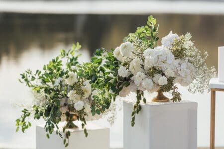 All white wedding arrangements and wedding details